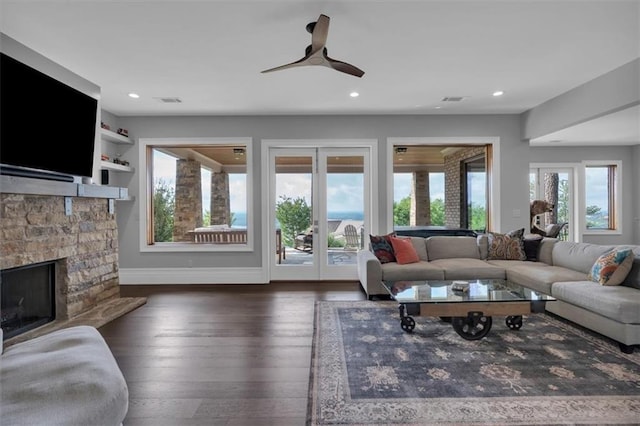 89 Somerset Ln, Cartersville, GA 30121 - living area with a stone fireplace, baseboards, wood finished floors, recessed lighting, and ceiling fan