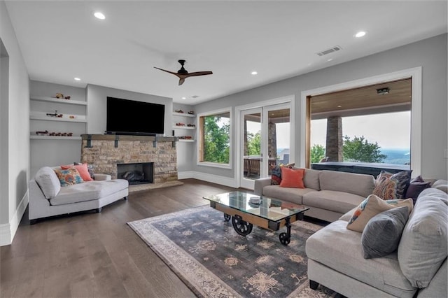 89 Somerset Ln, Cartersville, GA 30121 - living area with baseboards, a ceiling fan, dark wood-type flooring, recessed lighting, and a stone fireplace