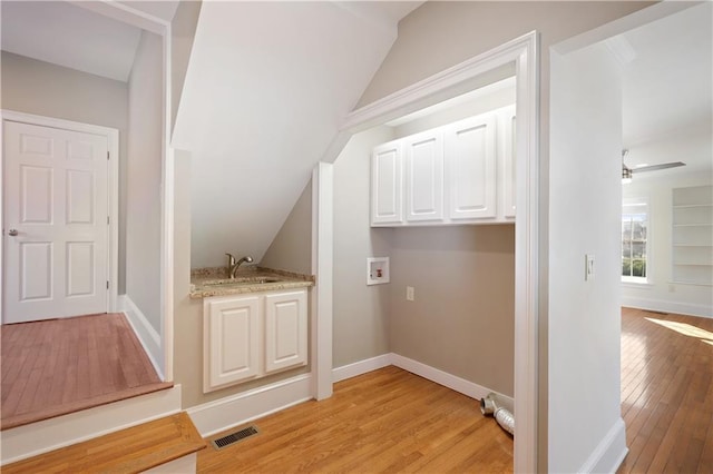 bonus room featuring ceiling fan, lofted ceiling, sink, and light hardwood / wood-style floors