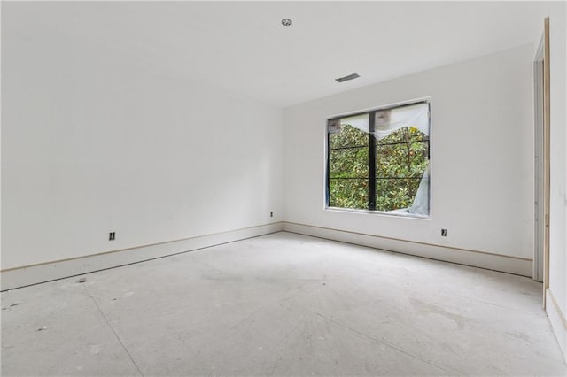 spare room with visible vents and baseboards