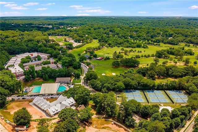 bird's eye view with a wooded view and golf course view