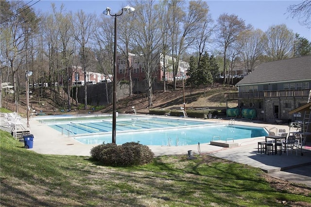 pool with a patio area