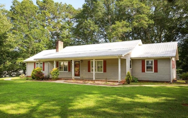 290 Timber Ridge Trl, Carrollton, GA 30117 - view of front of property featuring a chimney, a front yard, a metal roof, and covered porch