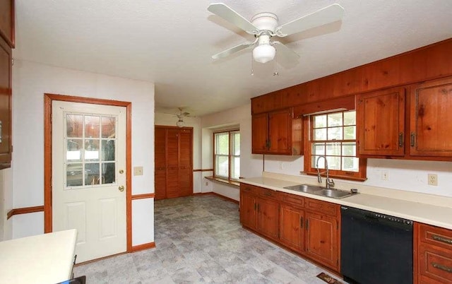 290 Timber Ridge Trl, Carrollton, GA 30117 - kitchen featuring black dishwasher, light countertops, light flooring, brown cabinetry, and a ceiling fan