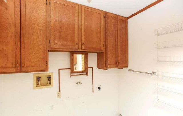 290 Timber Ridge Trl, Carrollton, GA 30117 - laundry room featuring electric dryer hookup, washer hookup, and cabinet space