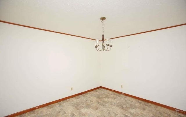 290 Timber Ridge Trl, Carrollton, GA 30117 - empty room featuring a chandelier and baseboards