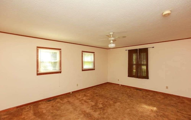290 Timber Ridge Trl, Carrollton, GA 30117 - spare room featuring carpet floors, a textured ceiling, crown molding, a smoke detector, and a ceiling fan