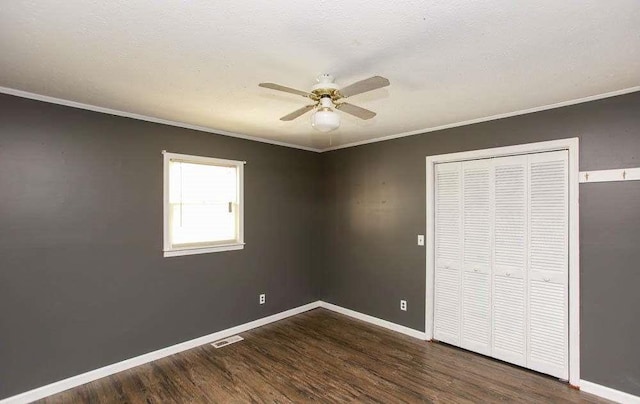290 Timber Ridge Trl, Carrollton, GA 30117 - unfurnished bedroom featuring wood finished floors, crown molding, a closet, and a ceiling fan