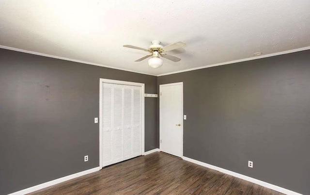 290 Timber Ridge Trl, Carrollton, GA 30117 - unfurnished bedroom with wood finished floors, a closet, ceiling fan, and crown molding