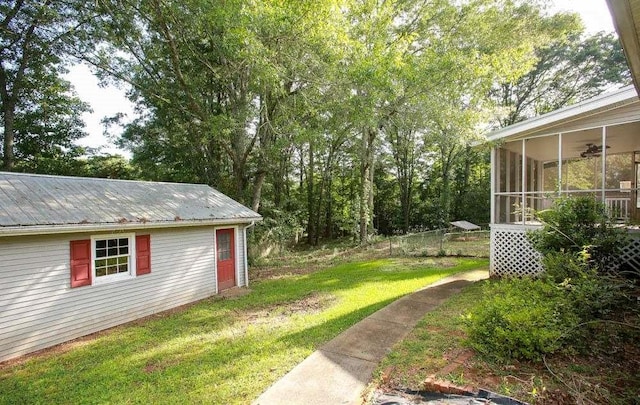 290 Timber Ridge Trl, Carrollton, GA 30117 - view of grassy yard featuring a sunroom and a ceiling fan