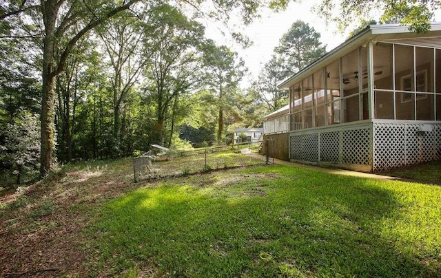 290 Timber Ridge Trl, Carrollton, GA 30117 - view of green lawn featuring a sunroom and a ceiling fan