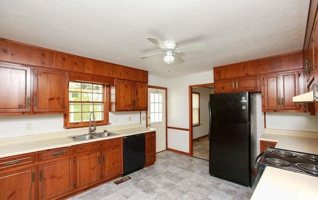 290 Timber Ridge Trl, Carrollton, GA 30117 - kitchen featuring black appliances, light flooring, light countertops, brown cabinetry, and ceiling fan