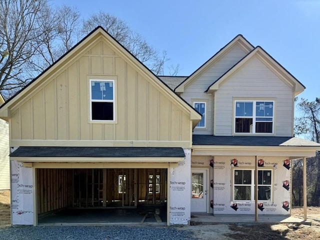 view of front of property featuring covered porch and a garage