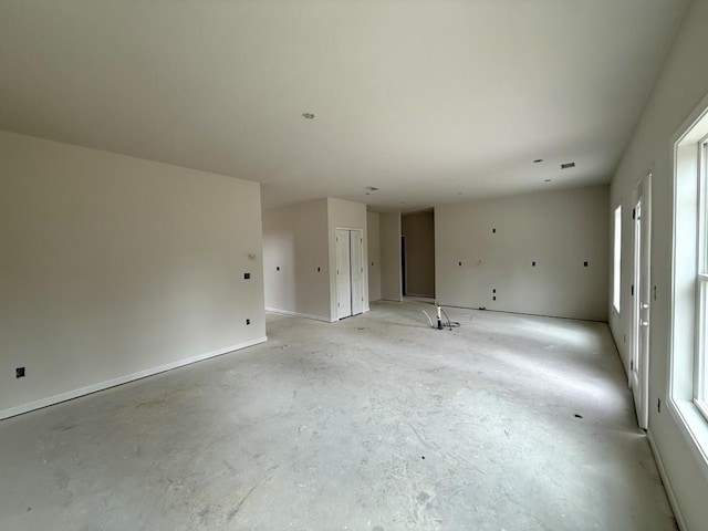 unfurnished room featuring plenty of natural light