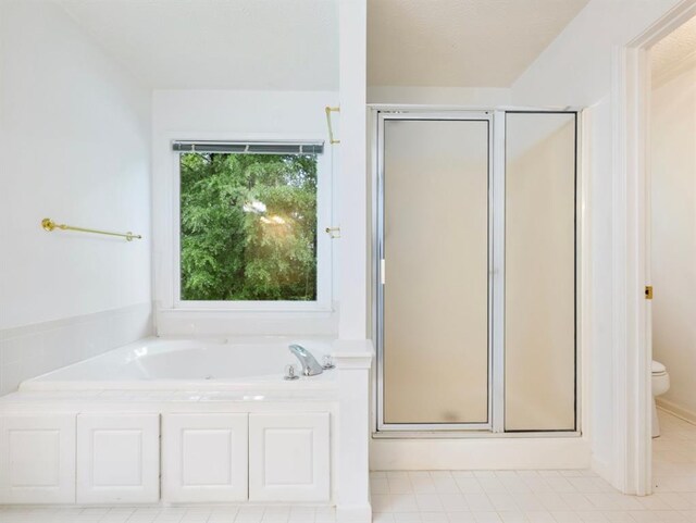 2910 Waverly Place Dr, Dacula, GA 30019 - full bath with a shower stall, toilet, a garden tub, and tile patterned flooring
