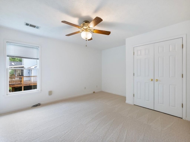 2910 Waverly Place Dr, Dacula, GA 30019 - unfurnished bedroom featuring light carpet, a closet, a ceiling fan, and baseboards