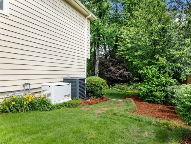 2910 Waverly Place Dr, Dacula, GA 30019 - view of green lawn featuring central air condition unit
