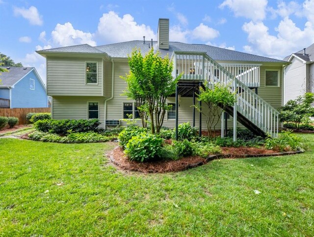 2910 Waverly Place Dr, Dacula, GA 30019 - back of property with stairway, a wooden deck, and a chimney