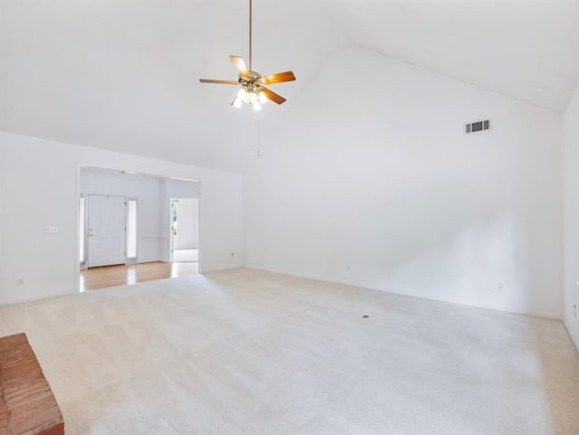 2910 Waverly Place Dr, Dacula, GA 30019 - unfurnished living room with light carpet, high vaulted ceiling, and ceiling fan