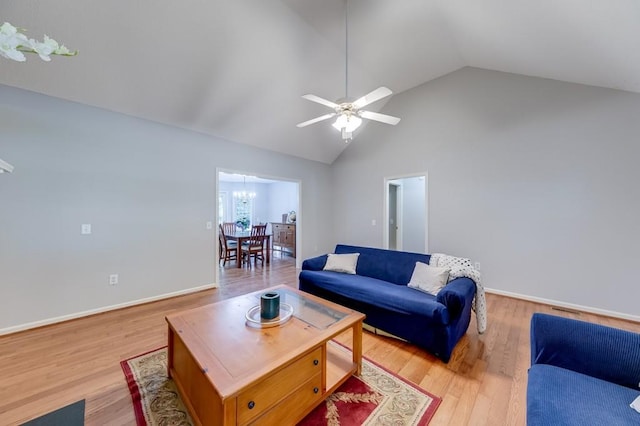 215 Twin Creek Shrs, Athens, GA 30605 - living area featuring light wood-style flooring, ceiling fan, a chandelier, and high vaulted ceiling