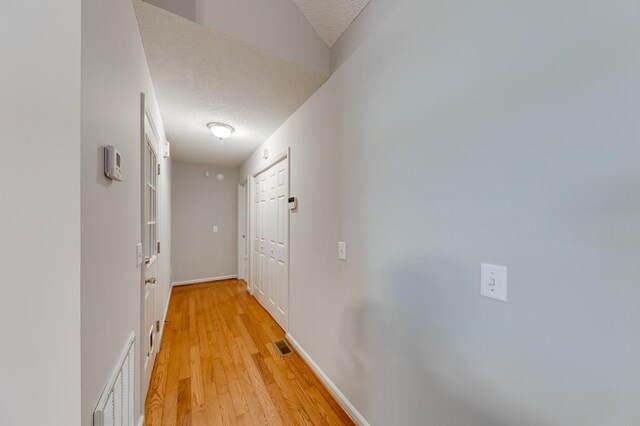 215 Twin Creek Shrs, Athens, GA 30605 - corridor with a textured ceiling and light wood-style floors