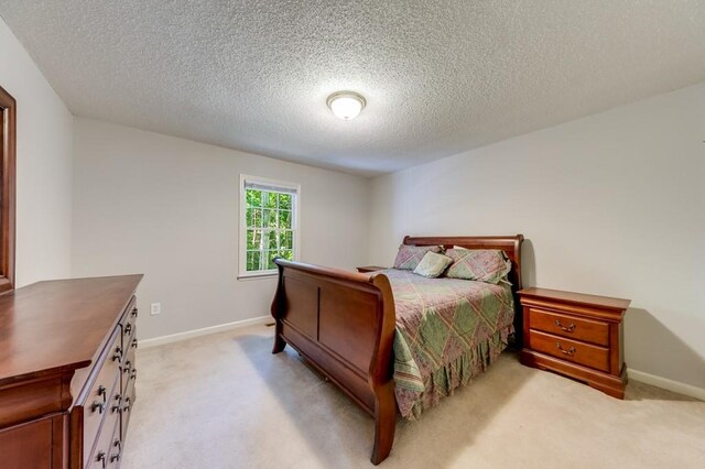 215 Twin Creek Shrs, Athens, GA 30605 - bedroom with light carpet and a textured ceiling
