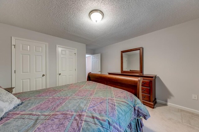 215 Twin Creek Shrs, Athens, GA 30605 - carpeted bedroom with baseboards and a textured ceiling