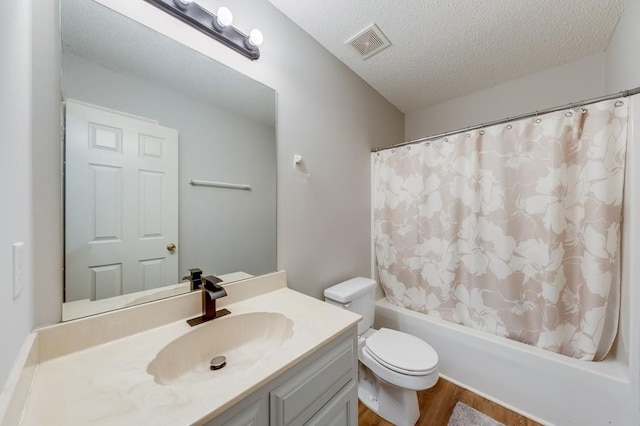 215 Twin Creek Shrs, Athens, GA 30605 - bathroom featuring wood finished floors, vanity, shower / tub combo with curtain, and a textured ceiling