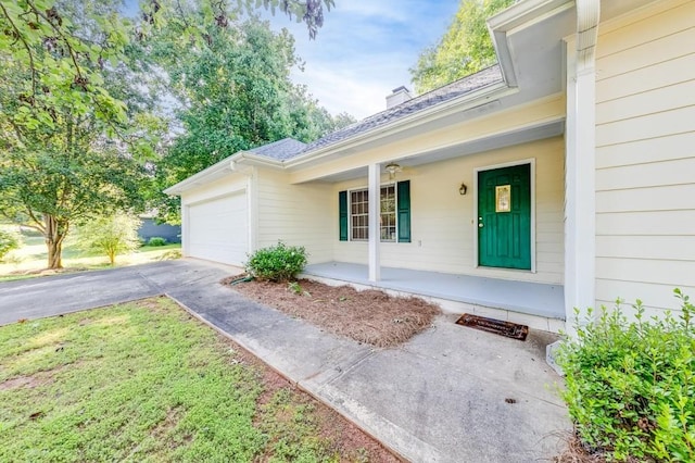 215 Twin Creek Shrs, Athens, GA 30605 - entrance to property with covered porch, concrete driveway, an attached garage, and a chimney