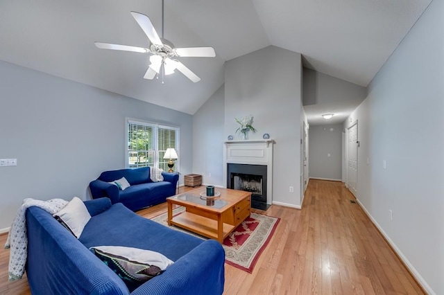215 Twin Creek Shrs, Athens, GA 30605 - living area featuring light wood-style flooring, lofted ceiling, a ceiling fan, and a fireplace with flush hearth