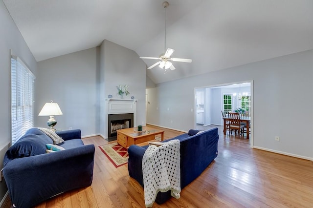 215 Twin Creek Shrs, Athens, GA 30605 - living room with light wood-style flooring, a fireplace, a ceiling fan, and high vaulted ceiling
