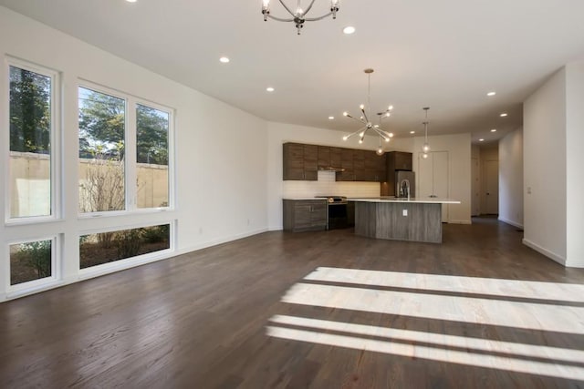 2194 Bristol Cv Unit 13, Chamblee, GA 30341 - unfurnished living room with a chandelier, recessed lighting, and dark wood finished floors