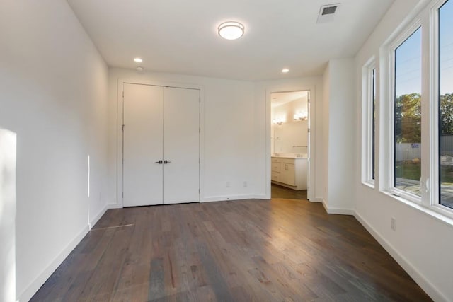 2194 Bristol Cv Unit 13, Chamblee, GA 30341 - unfurnished bedroom featuring recessed lighting, dark wood-style floors, a closet, and ensuite bath