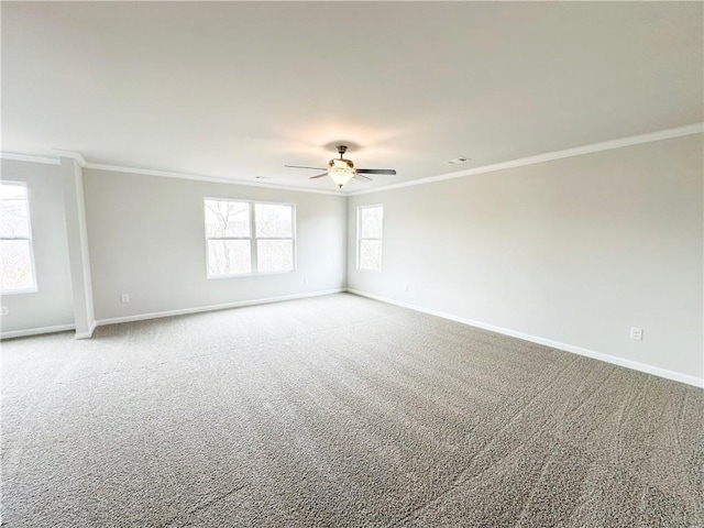 unfurnished room featuring light carpet, a ceiling fan, baseboards, and ornamental molding