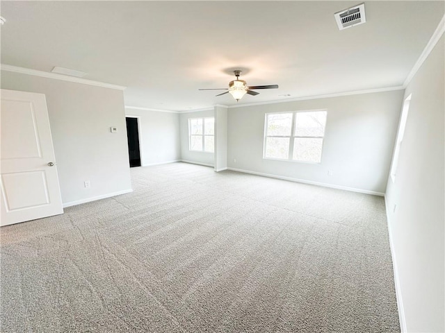 unfurnished room with baseboards, carpet floors, and ornamental molding