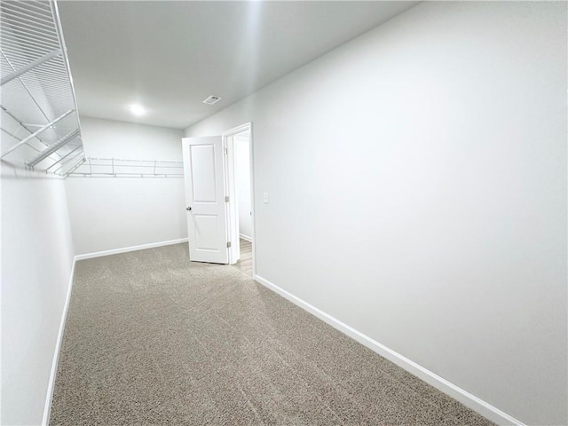 spacious closet featuring carpet flooring and visible vents