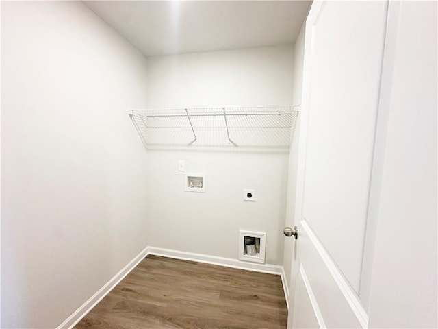 washroom with wood finished floors, baseboards, hookup for an electric dryer, laundry area, and washer hookup