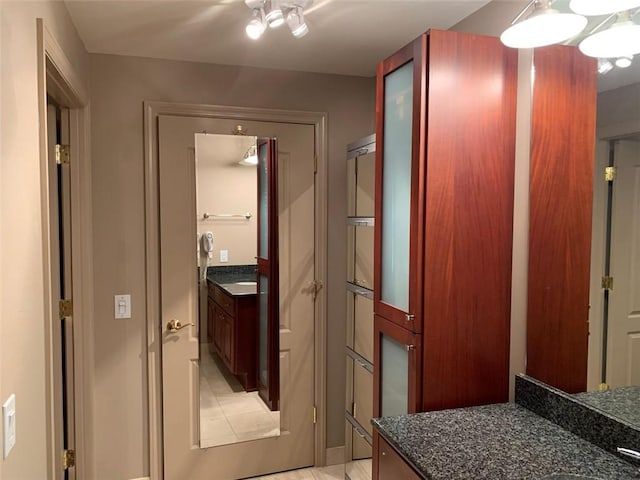 bathroom featuring tiled shower and toilet