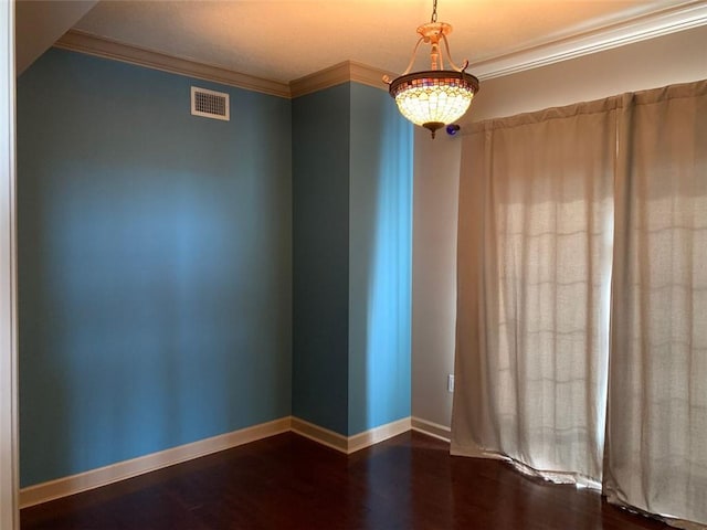 unfurnished room with crown molding and dark wood-type flooring