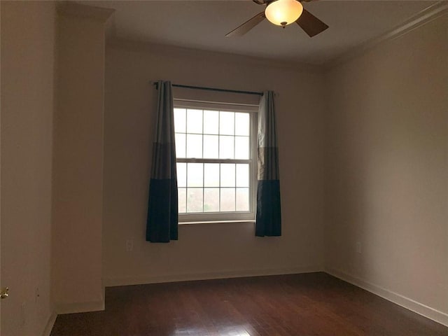 spare room featuring ceiling fan and dark hardwood / wood-style floors