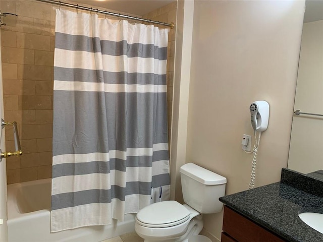 full bathroom featuring shower / tub combo with curtain, vanity, and toilet