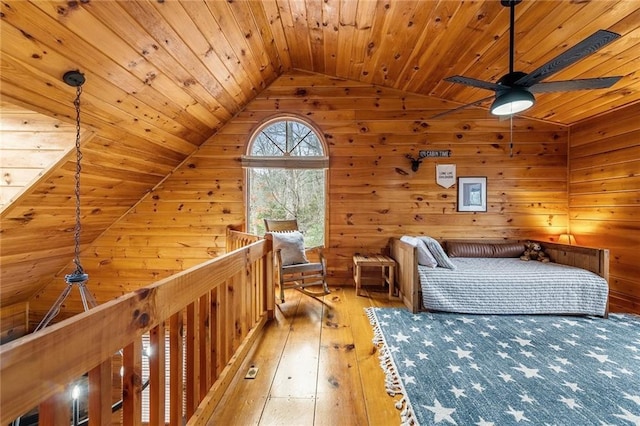 bedroom with wood walls, hardwood / wood-style floors, wooden ceiling, and vaulted ceiling