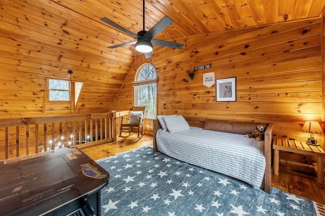 bedroom with wood ceiling, wood-type flooring, wooden walls, and vaulted ceiling