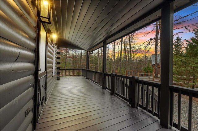 deck at dusk with a porch