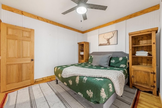 bedroom with hardwood / wood-style flooring and ceiling fan