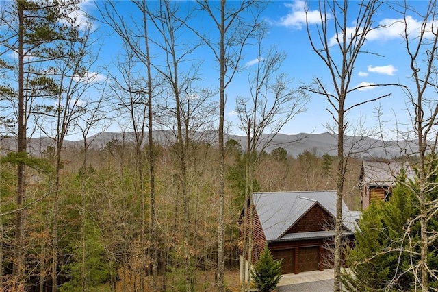mountain view featuring a wooded view