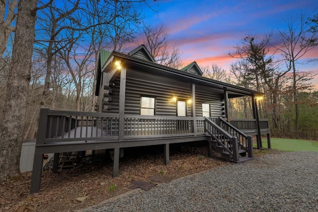 view of front of property with a wooden deck