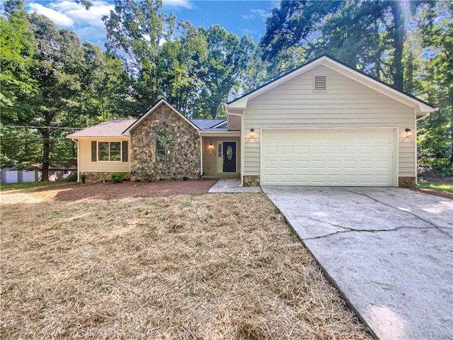 single story home featuring a front yard and a garage