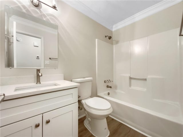 full bathroom featuring toilet, hardwood / wood-style floors, shower / bath combination, crown molding, and vanity