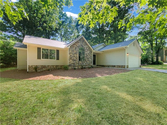 single story home with a front yard and a garage